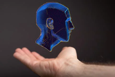 Person presenting the virtual projection of the polygonal human face Stock Photos