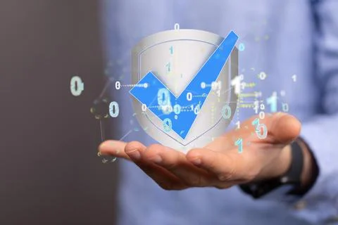 A person presenting the virtual projection of shield check mark icon with bin 写真素材