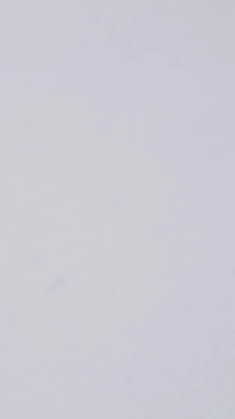 Person presses button of blue pen above white empty paper Stock Footage 317389792