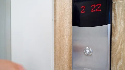 A person presses the Elevator button with toilet paper during Stock Footage 128126302