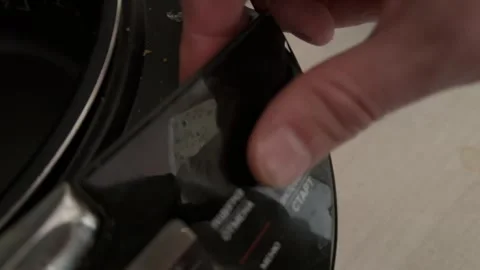Person pressing button on multicooker control panel close up at home, starting Stock Footage 337104786