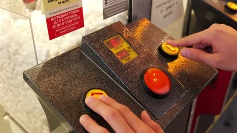 Person pressing buttons on arcade game control panel Stock Footage 340280965