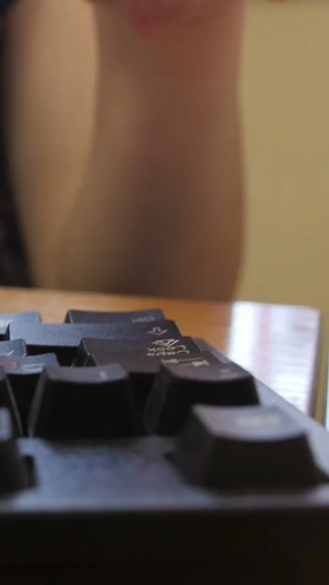Person pressing the caps lock key Stock Footage 332614219