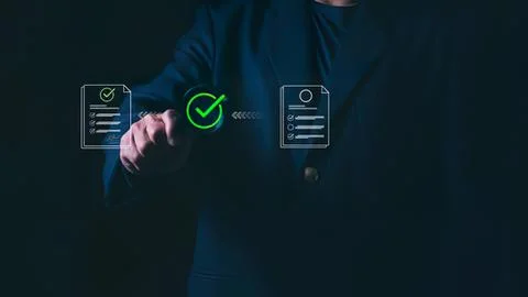 Person pressing digital checkmark on virtual document Stock Photos