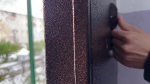Person pressing door opening button on intercom panel close up outdoors, Stock Footage 337104623