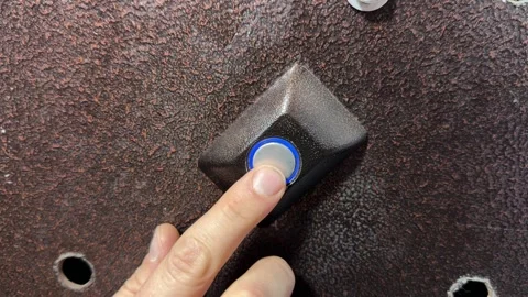 Person pressing door opening button on intercom panel close up outdoors, Stock Footage 337104632