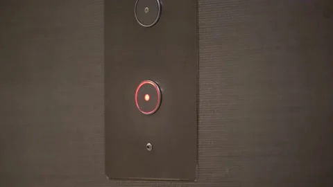 Person pressing down elevator button, illuminate downward lift button with Stock Footage 219980284