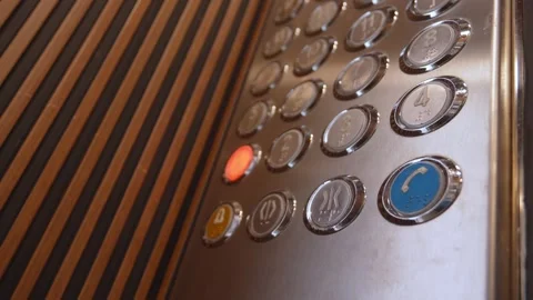 Person pressing the first floor button in an elevator Stock Footage 334759066