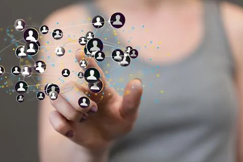 Person pressing on a floating digital render of interconnected profile icons Stock Photos