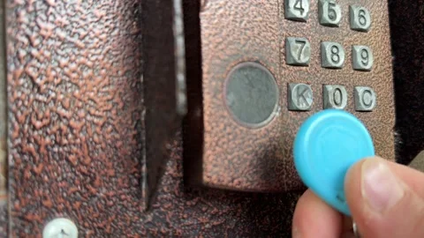 Person pressing intercom keypad button close up outdoors, entering code, access Stock Footage 337104713