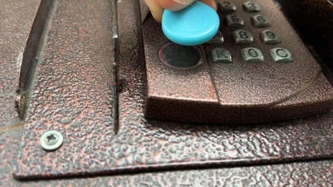 Person pressing intercom keypad button close up outdoors, entering code, access Stock Footage 337104715