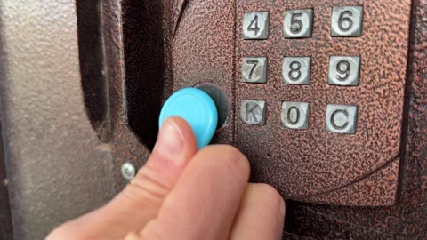 Person pressing intercom keypad button close up outdoors, entering code, access Stock Footage 337104730