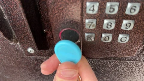 Person pressing intercom keypad button close up outdoors, entering code, access Stock Footage 337104731
