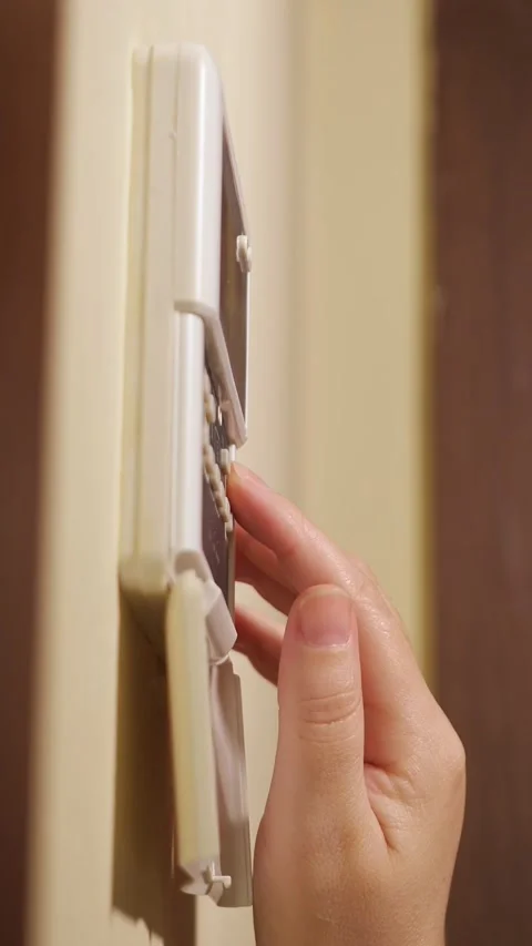 Person programming the home security alarm system, entering the secret pin code 스톡 동영상 342905232