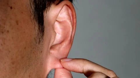 A person pulling on an earlobe Stock-Footage 334643468
