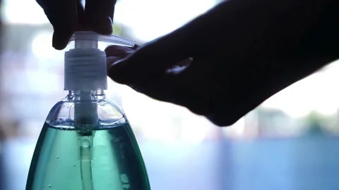 Person Pumping Turquoise Liquid Soap from Dispenser Bottle Video stock 335407880