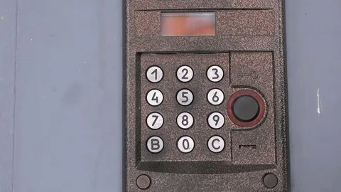 Person push buttons on a panel of intercom system Stock Footage 69213303