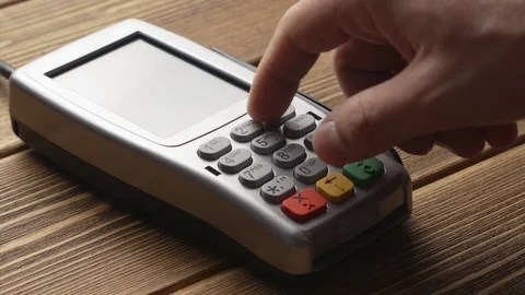 Person pushing the button and swipe credit card payment on pos terminal Stock-Footage 82783441