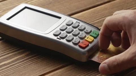 Person pushing the button and swipe credit card payment on pos terminal Stock Footage 82783890