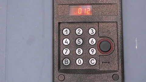 Person pushing buttons on the panel of intercom Stock Footage 71508247