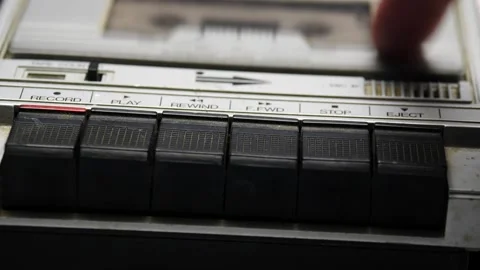 Person pushing the record button in a retro recorder Stock-Footage 169684378