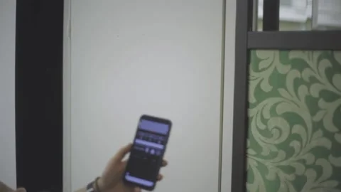 Person puts hand in front of camera with digital slate app and puts hand away Stock Footage 148677577