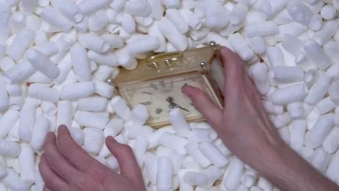 The person puts old watch in a box with a soft filling. Stock Footage 197571455