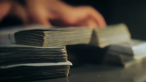 Person puts stack of money on surface. Concept of winner in gambling. 库存影片 195009466