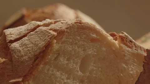 A person puts very fresh bread on the table. close-up business during a pandemic Stock Footage 229642141