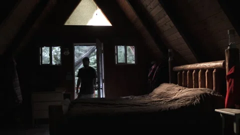 Person Putting On Flannel Jacket In Log Cabin Stock Footage 318045622