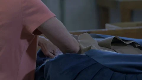 Person Putting Stuffing in Cushion Stock-Footage 100852304