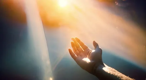 Person reaching towards sun, symbolizing hope and connection with nature Stock Footage 278974008