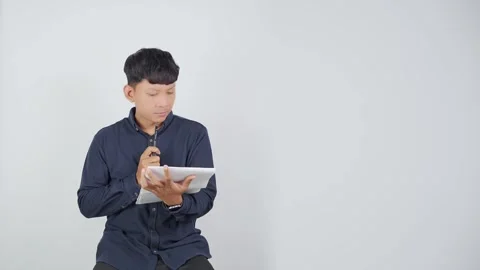 Person Reading Book With Focused Expression Vídeo Stock 344830751