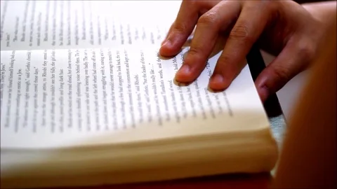 Person reading a book Video stock 94200715