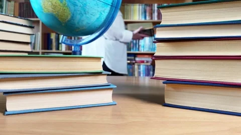 A person reading in a library 動画素材 251709612