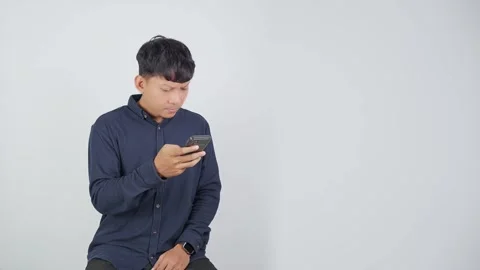 Person Reading Message While Focusing on Smartphone Vidéo 344830748