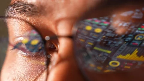 A person with a real-time data interface reflected analytics. Stock Footage 324839442