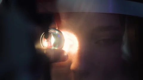 Person receiving an eye exam with a light in a clinic setting Stock Footage 340422907