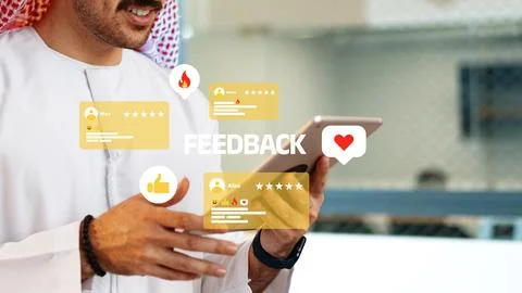 Person receiving feedback while using a tablet in an office setting during Stock Photos