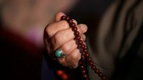 A person reciting mantras Stock Footage 128029341