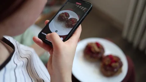 Person recording a video of Easter cakes decorated with chocolate, raspberries,  Stock Footage 305295045
