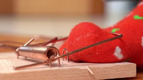 Person in red sock with hearts pattern struggles to free foot Video stock 262289774