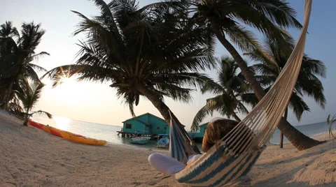 Person relaxing in hammock Stock Footage 25510673