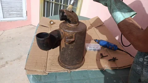 Person remove rust off a car air filter with a drill outdoors, audio Stock Footage 171085038