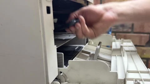 Person removing and inserting printer cartridge, maintenance and replacement Stock Footage 337110541