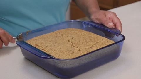 Person Removing Corn Bread From Glass Mold Stock Footage 110963480