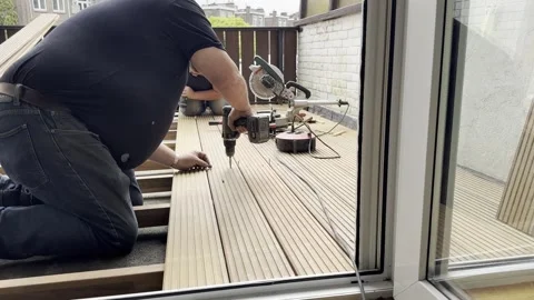 Person replacing old with new deck Stock Footage 260039143