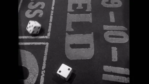 Person rolling dice on craps table Stock Footage 260257175