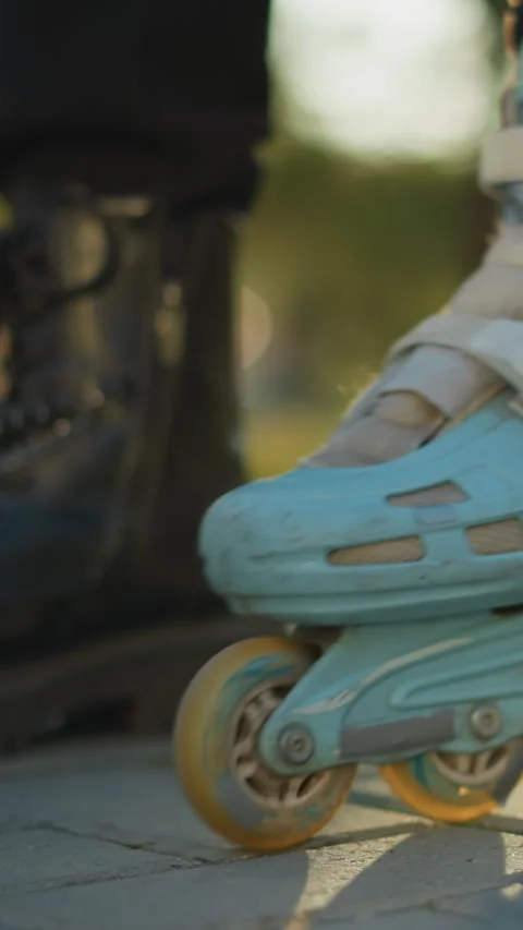 Person Rolling in Rollerblade While Transitioning from Black Boot in a Park Stock Footage 310492245
