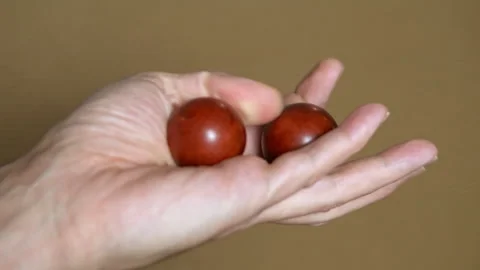 Person rotating chinese baoding balls in hand for health 库存影片 329581859